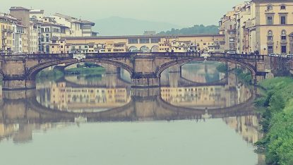 The Ponte Vecchio ("Old Bridge") Over The Arno River In Florence, Italy