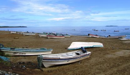 Fishing Boats Near Pedasi, Panama On The Eastern Azuero Peninsula. Isla Iguana Is In The Background