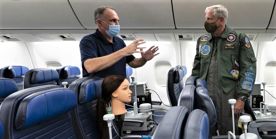 Vice Adm. Dee Mewbourne (right), deputy commander for U.S. Transportation Command, receives a briefing.